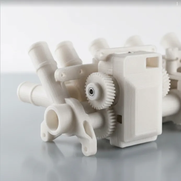 PA12 3D printing service India — Nylon 12 printed assembly with manifold runners, gear and housing